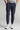 A person wearing navy cropped dynamic stretch golf trousers