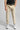 A person wearing cappuccino cropped dynamic stretch golf trousers