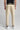 A person wearing cappuccino cropped dynamic stretch golf trousers