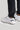 A person wearing golf trousers with stretch, in black