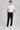 A person wearing golf trousers with stretch, in black