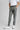 A person wearing a belt with a tri-colour design