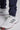 A man wearing navy stretch blue golf trousers