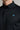 A man wearing a golf polo in black, regular fit
