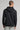 A male model wearing a sweat hoodie in black