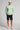 A man wearing a crew neck sweatshirt in green