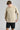 A man wearing a crew neck sweatshirt in softstone colour