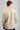 A man wearing a crew neck sweatshirt in softstone colour