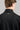 A person wearing a jacket in black with quilted baffle upper panels