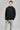 A man wearing a fleece jacket in black