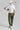 A person wearing green woven golf joggers