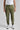 A person wearing green woven golf joggers