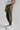 A person wearing green woven golf joggers