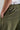 A person wearing green woven golf joggers