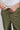 A person wearing green woven golf joggers