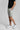 A person wearing golf shorts in grey