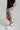 A person wearing golf shorts in grey