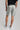 A person wearing golf shorts in grey
