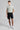 A person wearing golf shorts in black