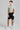 A person wearing golf shorts in black