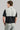 Man wearing golf polo Black and grey