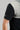 Man wearing golf polo Black and grey