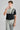 Man wearing golf polo Black and grey