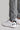 A person wearing golf trousers in grey