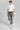 A person wearing golf trousers in grey