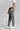 A person wearing golf trousers in grey