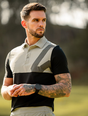 Man wearing golf polo Black and grey