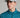 A person wearing a golf cap in grey colour, size fitted