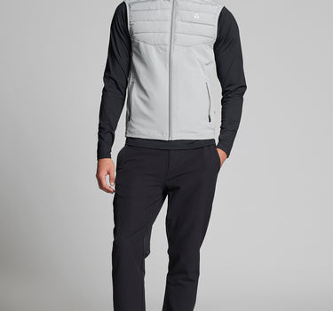 A male model wearing a golf gilet in grey
