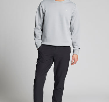 A man wearing black stretch blue golf trousers