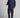 A man wearing navy stretch blue golf trousers