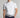 A man wearing a golf polo in white, regular  fit