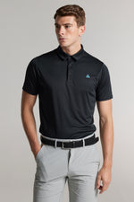 A man wearing a golf polo in black, regular  fit
