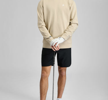 A man wearing a crew neck sweatshirt in softstone colour