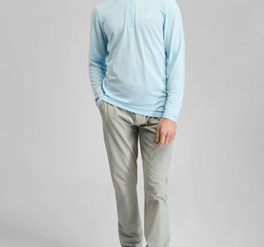 A person wearing a zip top in blue