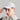 A man wearing a golf cap with ball marker in grey