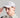 A man wearing a golf cap with ball marker in grey