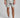 A person wearing golf shorts in grey