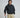 A man modeling a dark navy hoodie and beige golf pants, holding a golf club against a light gray studio background.
