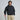 A man modeling a dark navy hoodie and beige golf pants, holding a golf club against a light gray studio background.