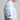 Person wearing a blue and white tie-dye shirt with a visible brand logo on a gray background