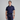 Man wearing a navy blue golf outfit with a white background