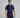 Man wearing a navy golf outfit with a white background