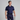 Man wearing a navy golf outfit with a white background