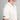 White polo shirt with green trim and ATSG logo on a gray background